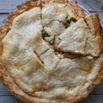 Golden homemade chicken pot pie baked in a flaky pie crust.