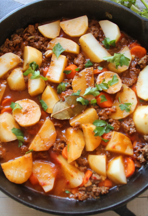 A cozy old-fashioned beef and potato skillet called The Forgotten Supper, featuring tender potatoes, carrots, ground beef, and a rich homemade gravy.