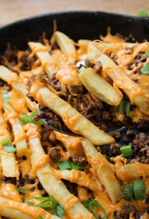 Cheeseburger and fries skillet with melted cheese and crispy fries