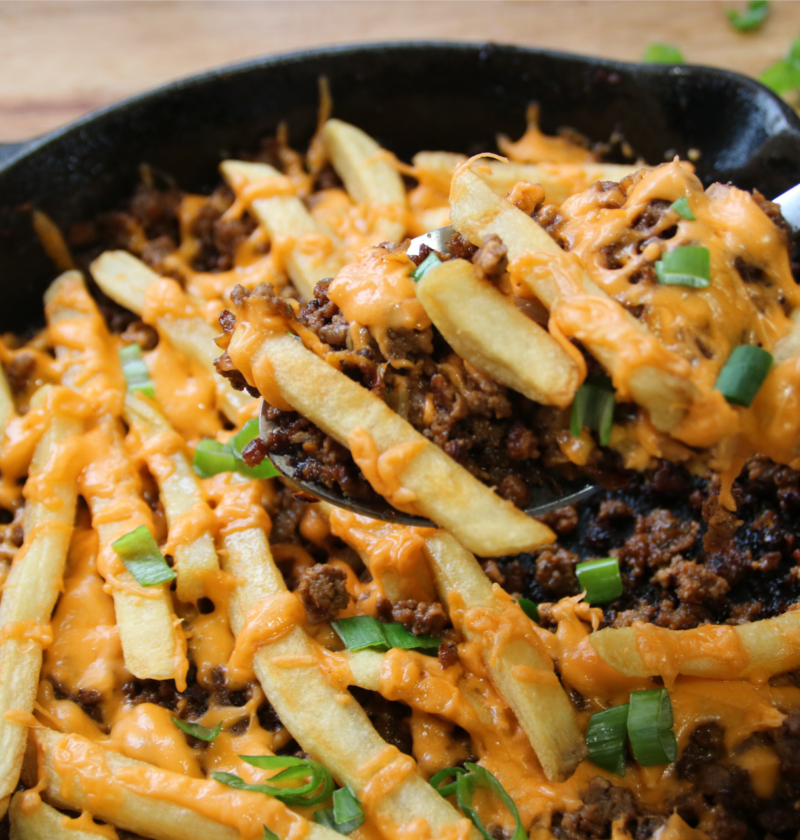 Cheeseburger and fries skillet with melted cheese and crispy fries