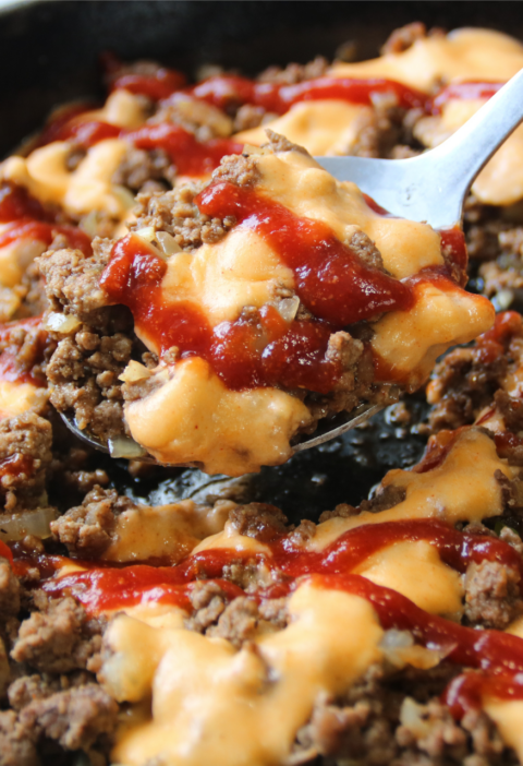 Saucy Ground Beef Skillet topped with creamy cheddar sauce and tangy sauce