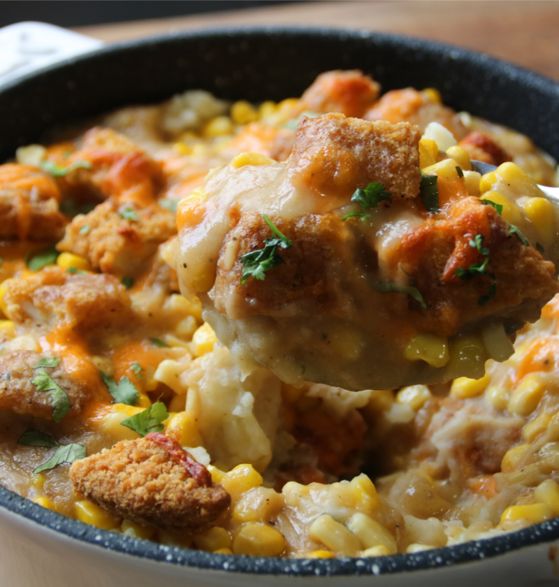 KFC Chicken Bowl Bake served with crispy chicken, mashed potatoes, corn, gravy, and melted cheese