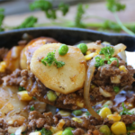 Old School Ground Beef and Potato Supper in a cast iron skillet
