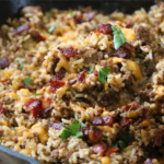 Dad’s Bacon Cheeseburger Rice with ground beef, crispy bacon, melted cheddar cheese, and rice in a skillet