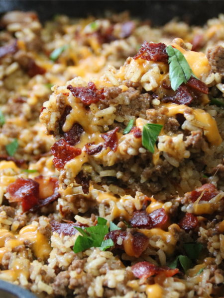 Dad’s Bacon Cheeseburger Rice with ground beef, crispy bacon, melted cheddar cheese, and rice in a skillet