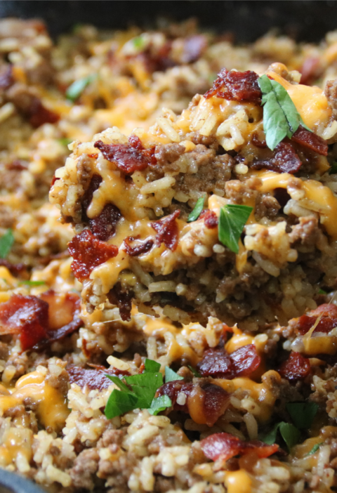Dad’s Bacon Cheeseburger Rice with ground beef, crispy bacon, melted cheddar cheese, and rice in a skillet