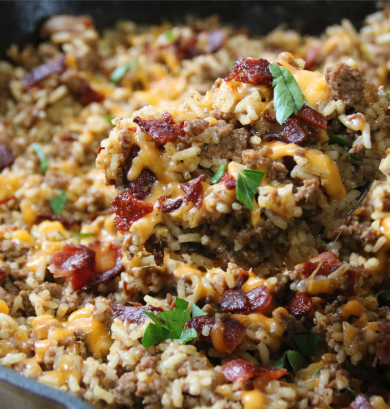 Dad’s Bacon Cheeseburger Rice with ground beef, crispy bacon, melted cheddar cheese, and rice in a skillet