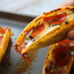 Crispy pizza tacos filled with seasoned ground beef, pizza sauce, mozzarella and pepperoni