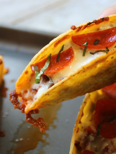 Crispy pizza tacos filled with seasoned ground beef, pizza sauce, mozzarella and pepperoni