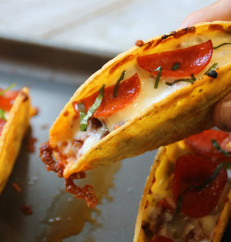 Crispy pizza tacos filled with seasoned ground beef, pizza sauce, mozzarella and pepperoni