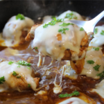 Timeless French Onion Chicken with melted Swiss cheese and caramelized onions in a rich savory gravy