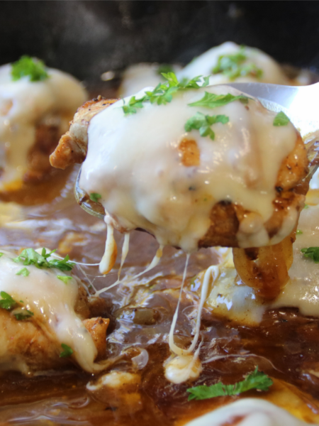 Timeless French Onion Chicken with melted Swiss cheese and caramelized onions in a rich savory gravy