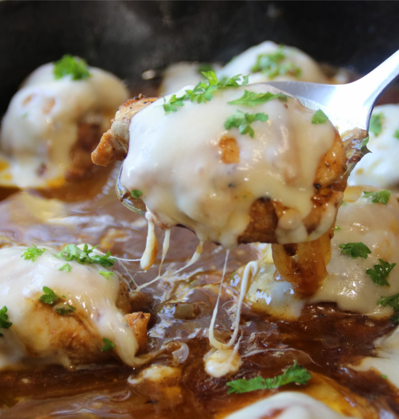 Timeless French Onion Chicken with melted Swiss cheese and caramelized onions in a rich savory gravy