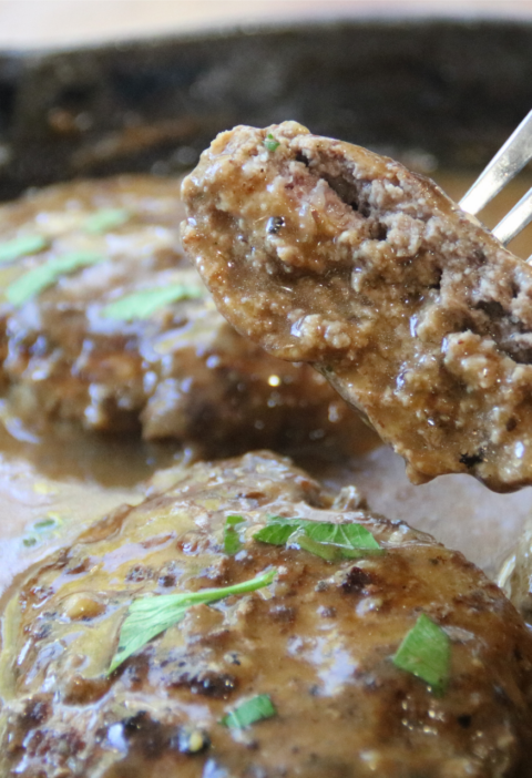 Old-Time Hamburger Steak with Grandpa’s Gravy in a cast-iron skillet