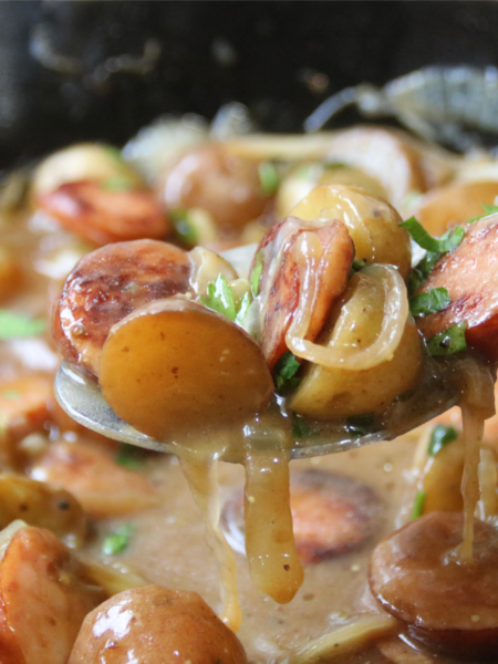 Poor Man’s Sunday Supper with smoked sausage, baby potatoes and onions in rich brown gravy