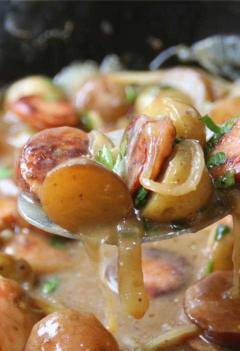 Poor Man’s Sunday Supper with smoked sausage, baby potatoes and onions in rich brown gravy
