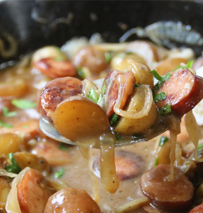 Poor Man’s Sunday Supper with smoked sausage, baby potatoes and onions in rich brown gravy