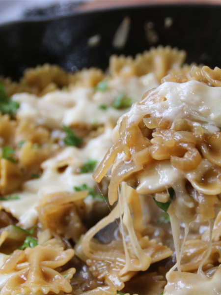 Old Cook's French Onion Pasta with caramelized onions, bow-tie pasta, and melted Swiss cheese